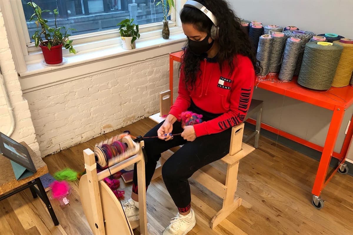 Working at a spinning wheel